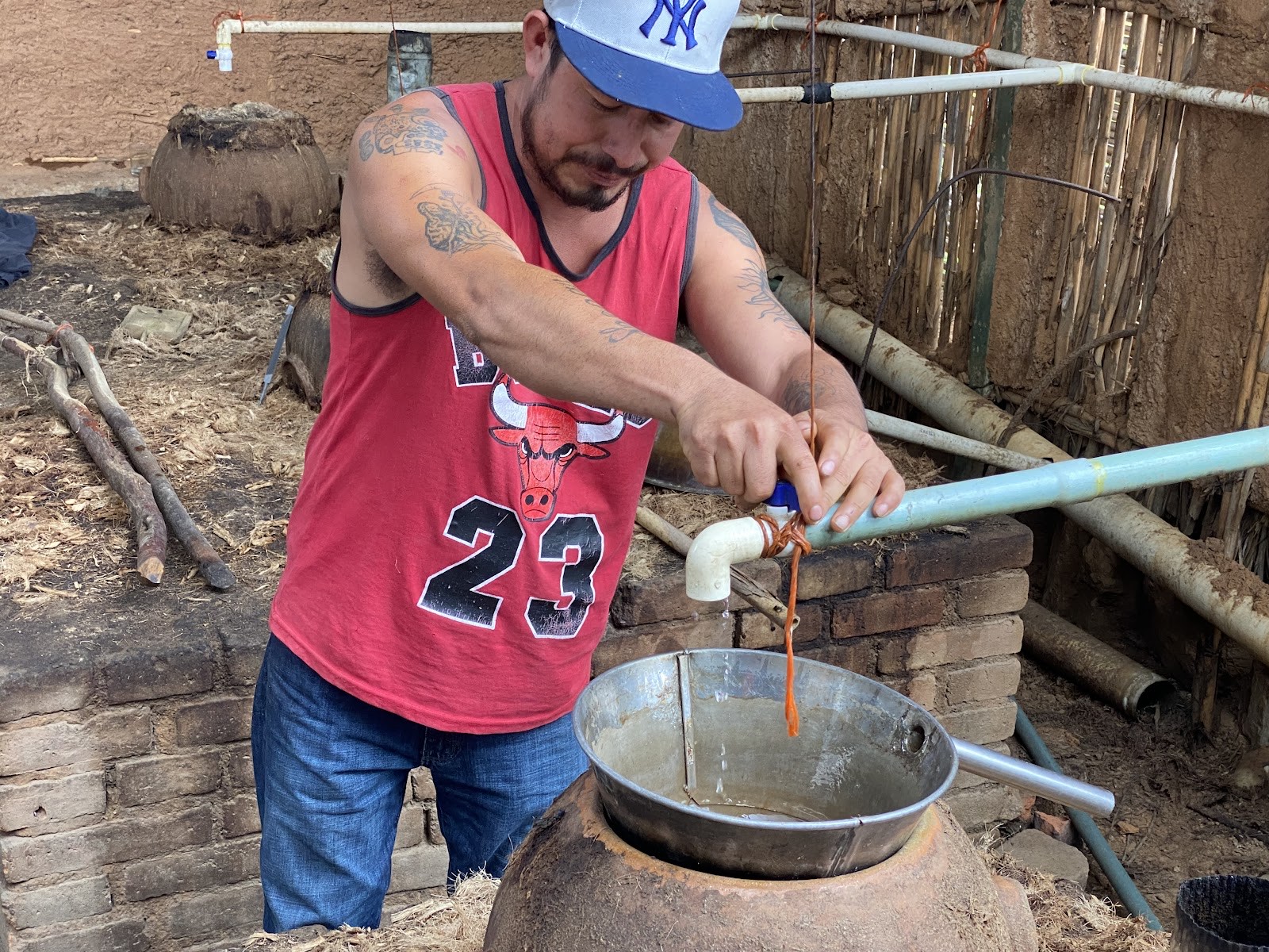 collecting the mezcal distillate