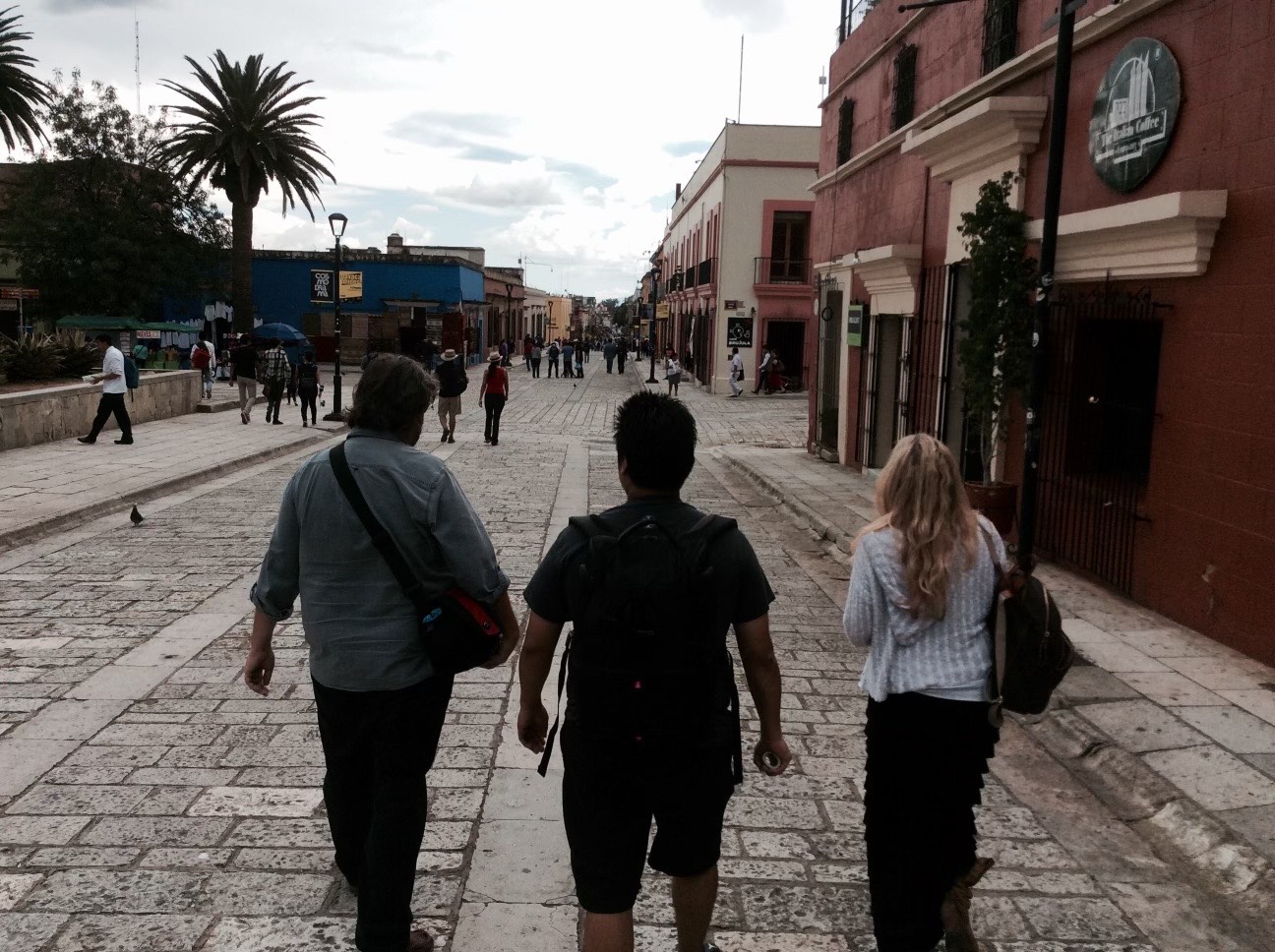 people walking an Oaxaca street