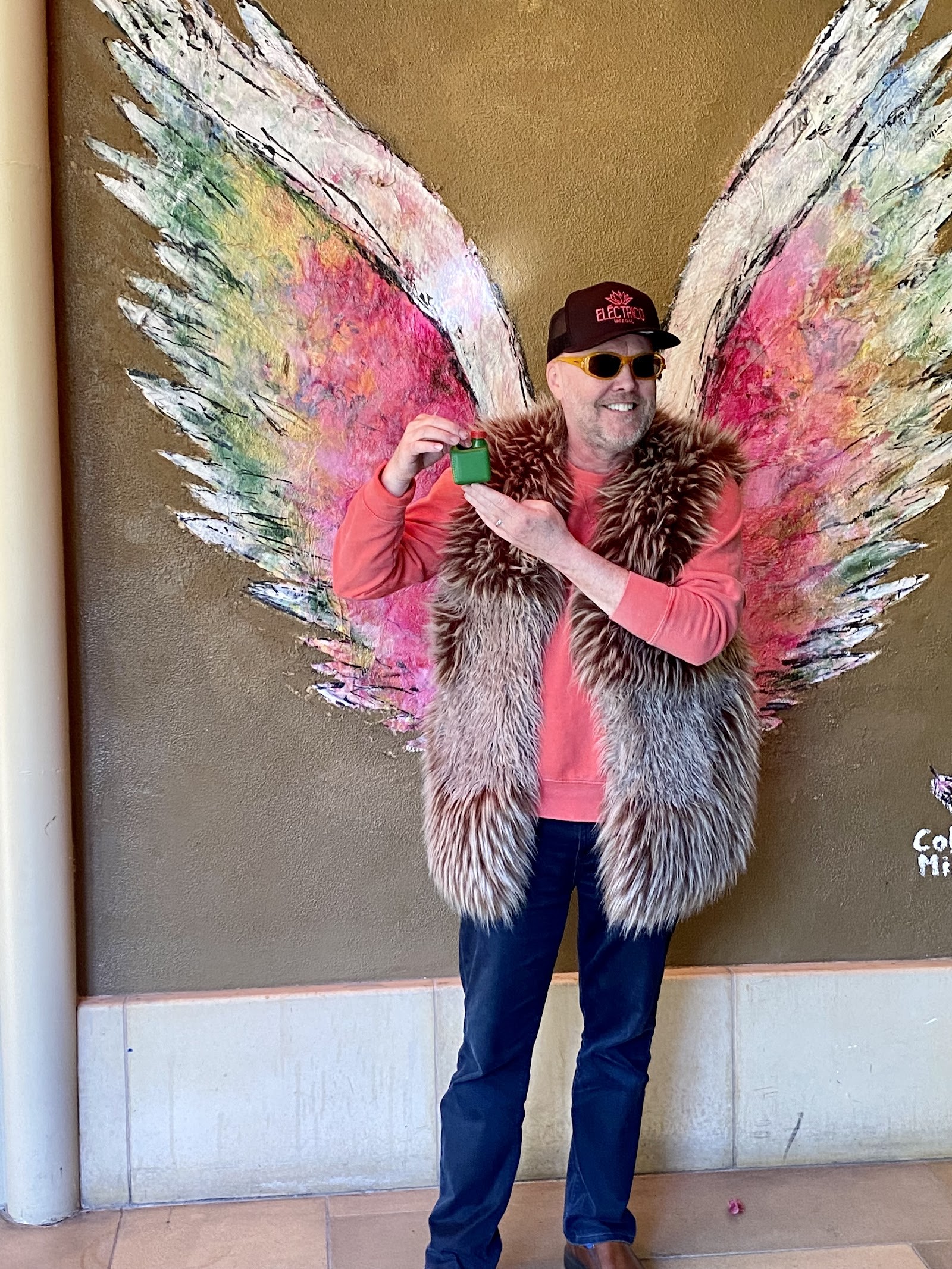 man posing with angel wings