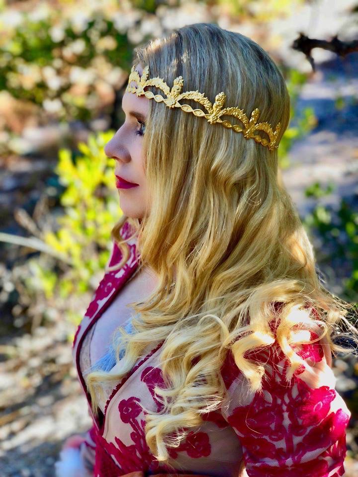 a portrait in a golden headpiece
